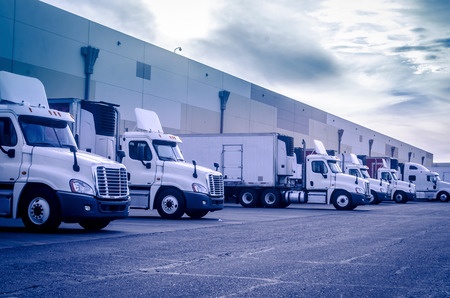 33002569 - trucks lorries loading unloading depot warehouse